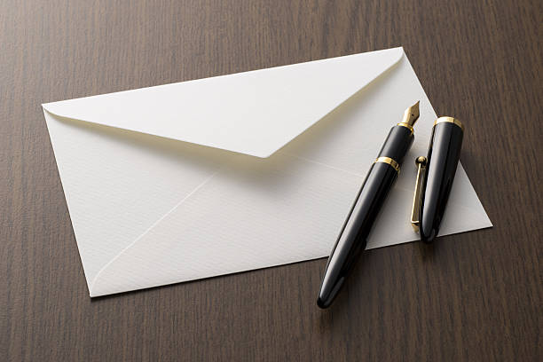 istock fountain pen and letter on table 639060086