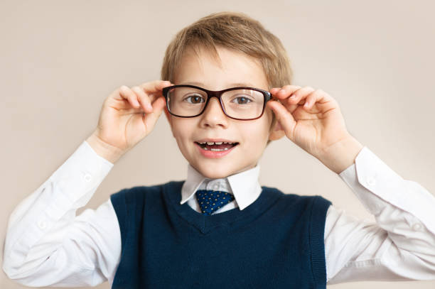 istock child boy teenager with glasses on a gray background. Objects 639060492
