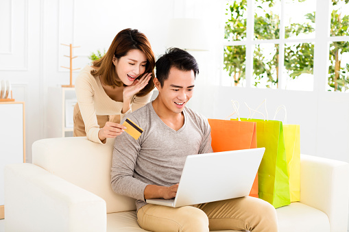 Young  couple  shopping online with credit card