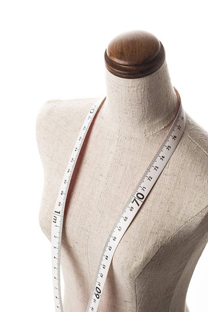 istock mannequin with a tape measure, close-up 639065348