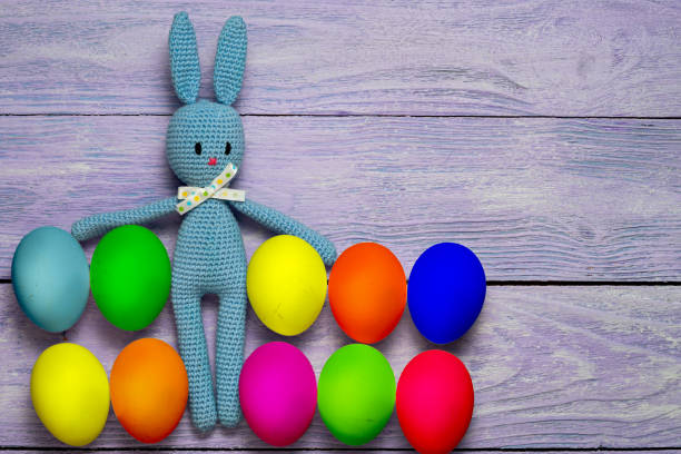 istock Amigurumi toy easter bunny with colorful eggs 639067558