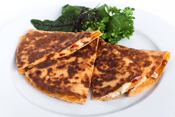 Fresh sliced mexican burritos close-up studio isolated