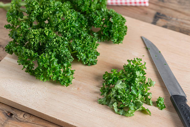 istock Parsley on wood cutting board. Selective focus. 639072458