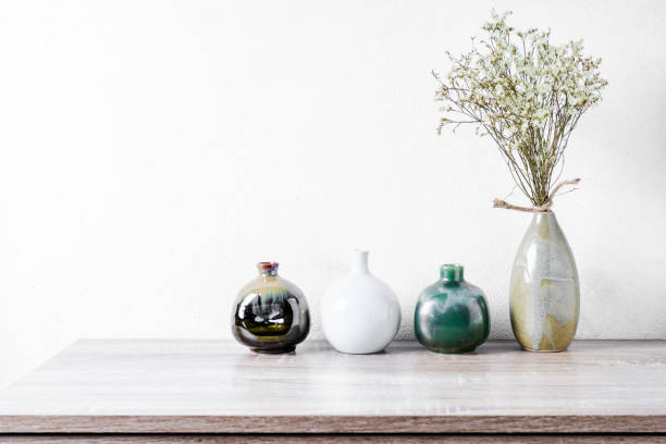 istock Decorative ceramic vases on wooden table, vintage tone 639072890