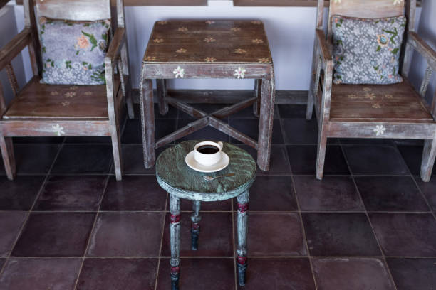 istock Black hot coffee on round vintage wooden table 639073230