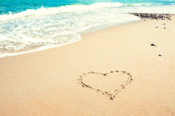 istock Shape of heart on the beach 639073286