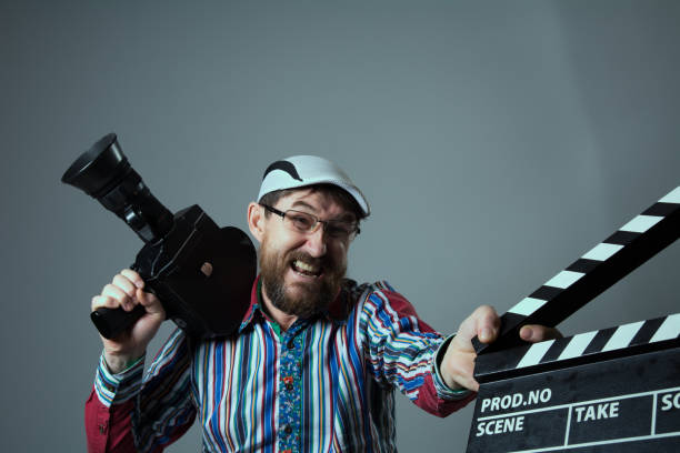 istock Screaming man retro movie camera and clapperboard 639075830