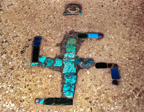 The Swastika sign was made of a variety of gems,such as Turquoise,on the floor of a temple.It is the auspicious symbol of Tibetan Buddhism.