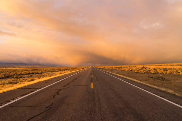 istock Orange Sunset Open Road Two Lane Highway Horizontal 639079526