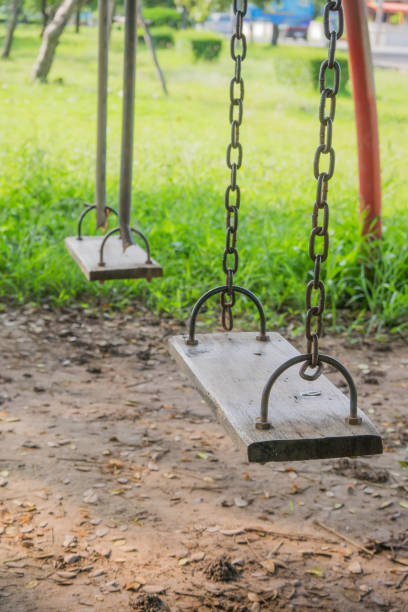 istock Old wooden swing in playground 639082620