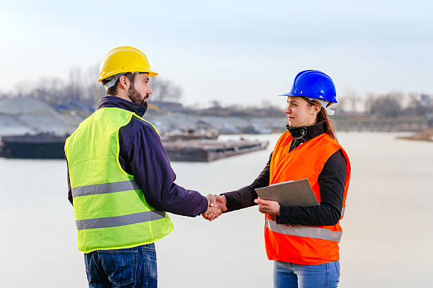 istock Engineers in shipyard handshake after successful shipment 639082746