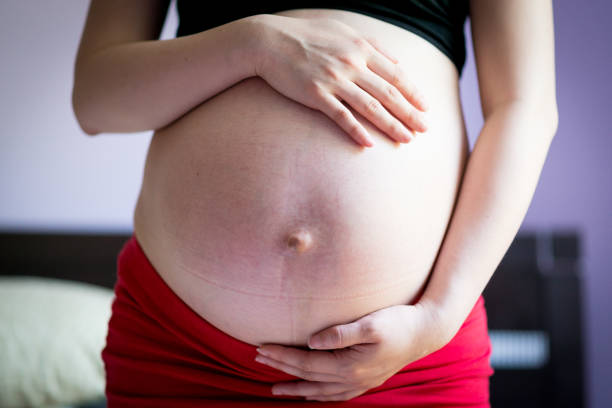 istock Pregnant lady holding her belly 639082848