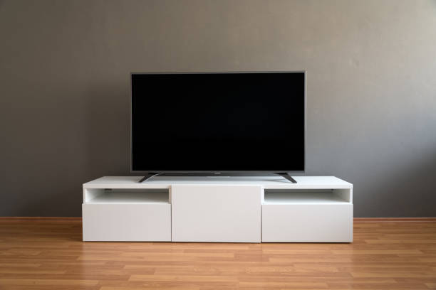 istock Flat LCD television on white cabinet 639083090