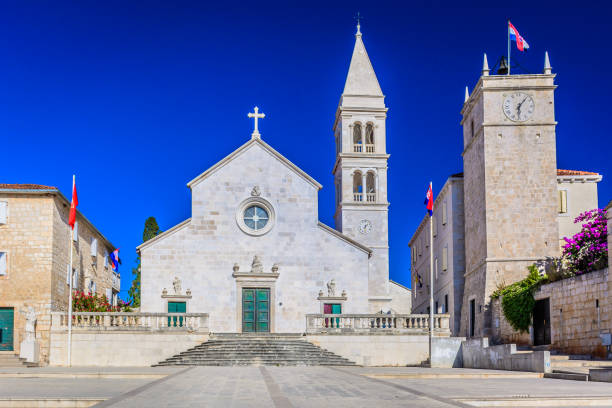 Cathedral landmark Supetar Brac. Historic old stone architecture of cathedral in Supetar, Island Brac, Croatia, european landmarks. old catholic church on island brac croatia stock pictures, royalty-free photos & images