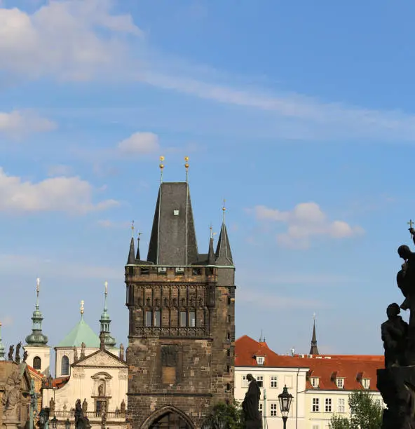 High tower with battlements from the Charles Bridge in Prague Old Town in Czech Republic Europe