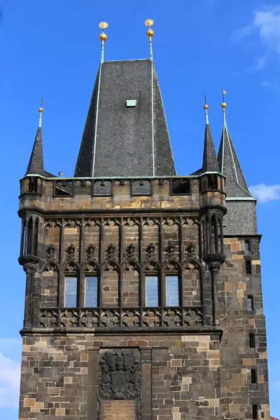 Detail of tower with battlements of the Charles Bridge in Prague Old Town in Czech Republic Europe