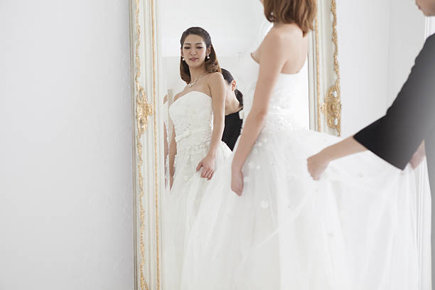 istock The bride stares at herself in the mirror. 639085600