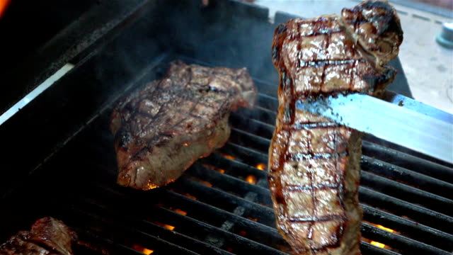Three videos of steaks on the fire-real slow motion