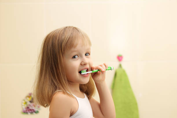 istock little girl clean teeth 639087976