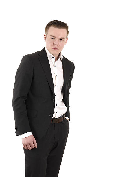 istock Young businessman looking at camera, isolated on white 639088636