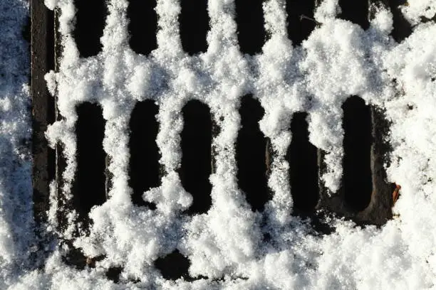 snow-covered manhole cover