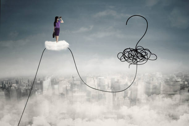 istock Businesswoman on cloud with question mark 639090096