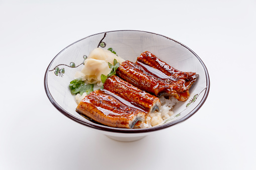 Unadon (Japanese Rice Bowl Topping with Grilled Japanese Freshwater Eel with Teriyaki Sauce) Served with Prickled Ginger.