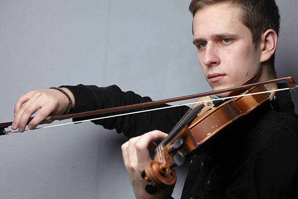 istock man playing violin close-up 639094770