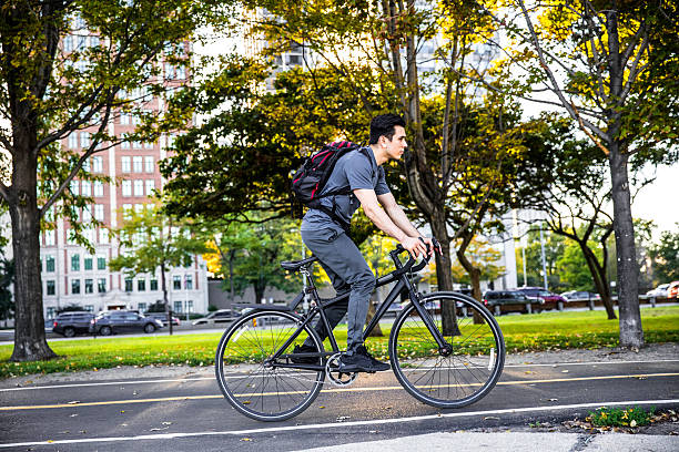 istock Young man cycling in the city, commuting to work 639098050
