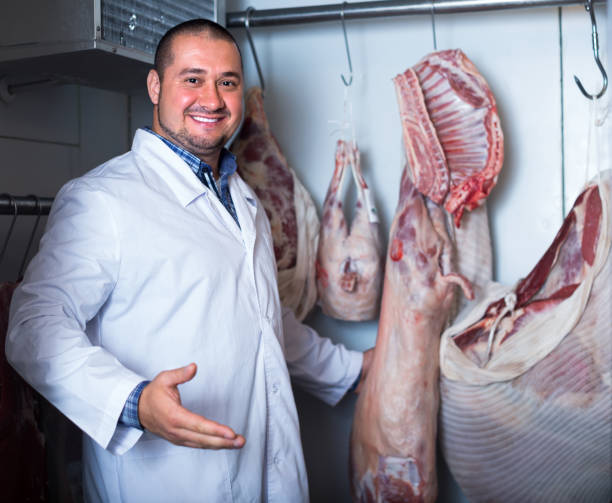 istock butcher working with meat in store 639098332