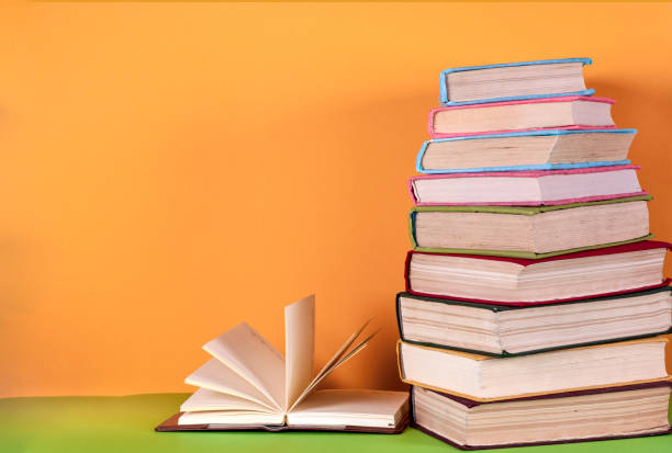 istock Open book, hardback bookson bright colorful background. 639098466