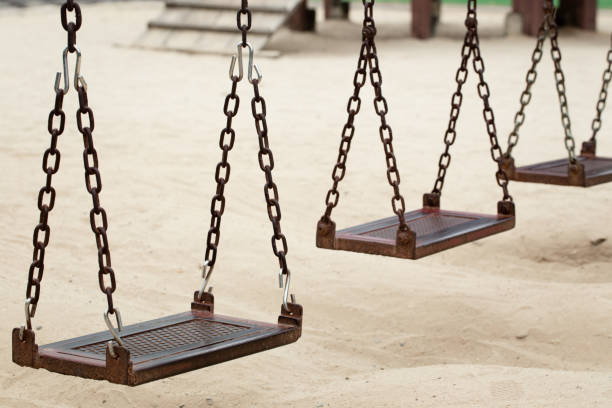istock Three swings iron sand from a hole to play. 639101436