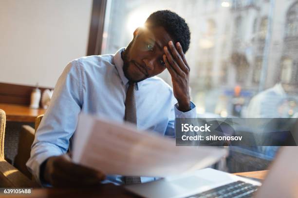 Confused Manager In Cafe Stock Photo - Download Image Now - Emotional Stress, Confusion, Business