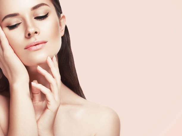 istock Beautiful woman face close up studio on pink 639106128