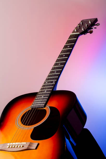 istock Acoustic guitar on a colored background 639106620