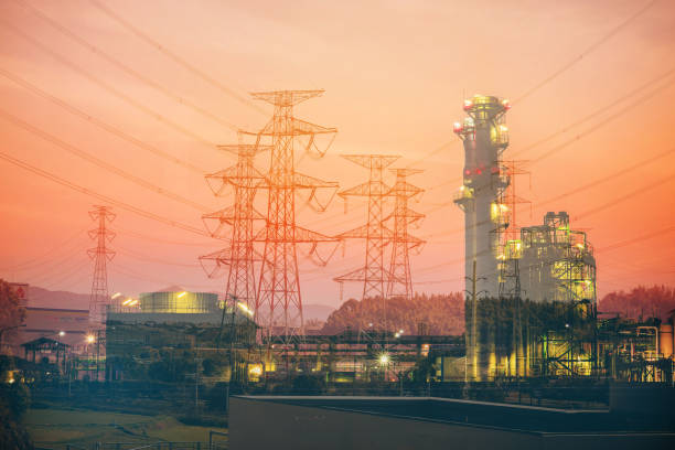 istock Double exposure high voltage pole and power plant 639108022