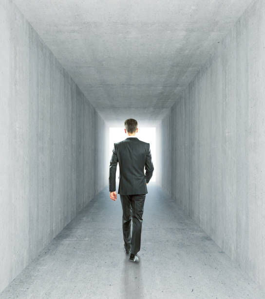 istock Businessman in concrete tunnel 639108062