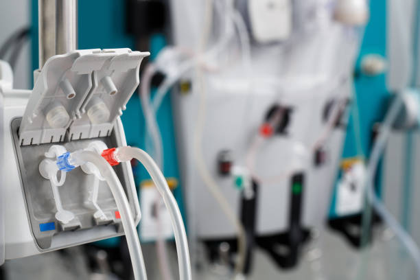 Hemodialysis bloodline tubes in dialysis machine Hemodialysis bloodline tubes connected to hemodialysis machine. Health care, blood purification, kidney failure, transplantation, medical equipment concept. dialysis stock pictures, royalty-free photos & images