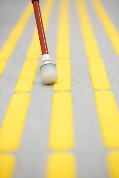 istock Blind pedestrian walking on tactile paving 639111506