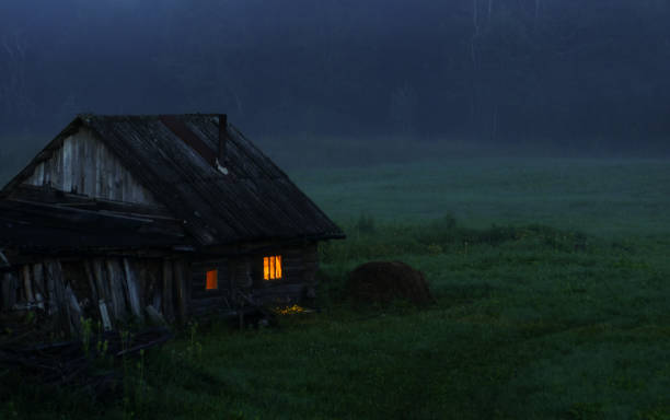 istock Grim lonely house at night in a field 639111698