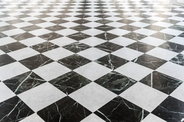 Photo of Black and white checkered marble floor