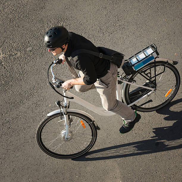 istock Urban young man riding electric bicycle 639112676
