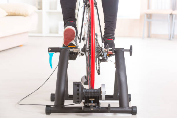 Man on bicycle trainer stock photo