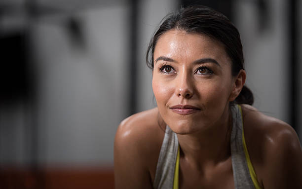 istock Woman exercising at the gym 639114520
