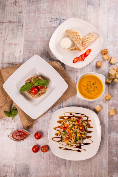 istock Soup, shawarma salad covered dining table 639115690