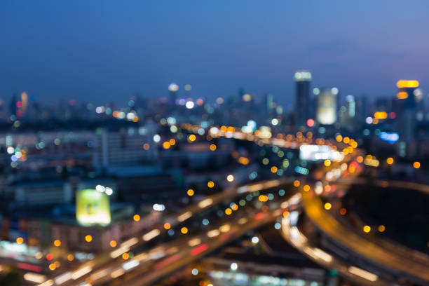 istock Blurred lights Highway intersection with city downtown 639117326