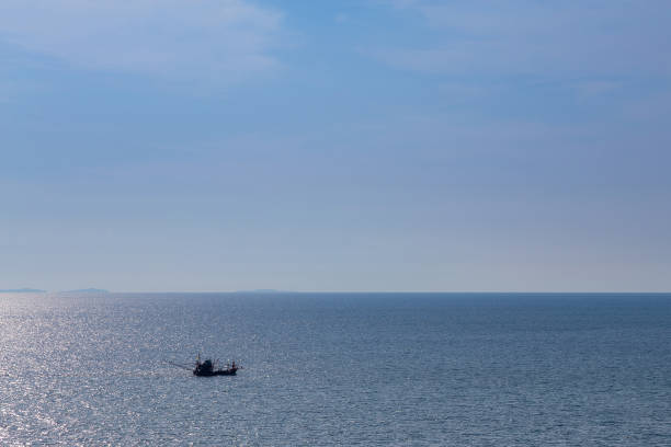 istock Finishing boat over coastline 639123384