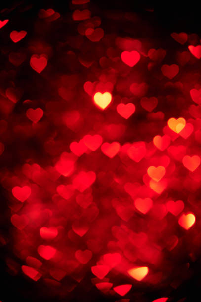 istock red heart bokeh background photo, abstract holiday backdrop 639123494
