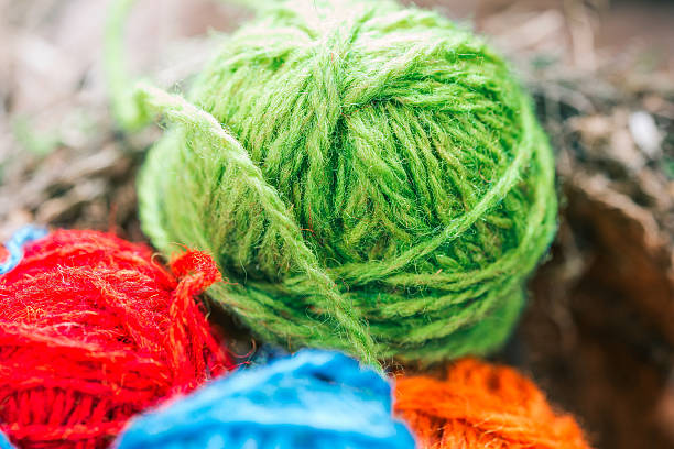 istock Yarn balls in natural log interior 639124718