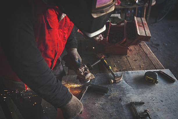 istock Man grinding metal 639125100